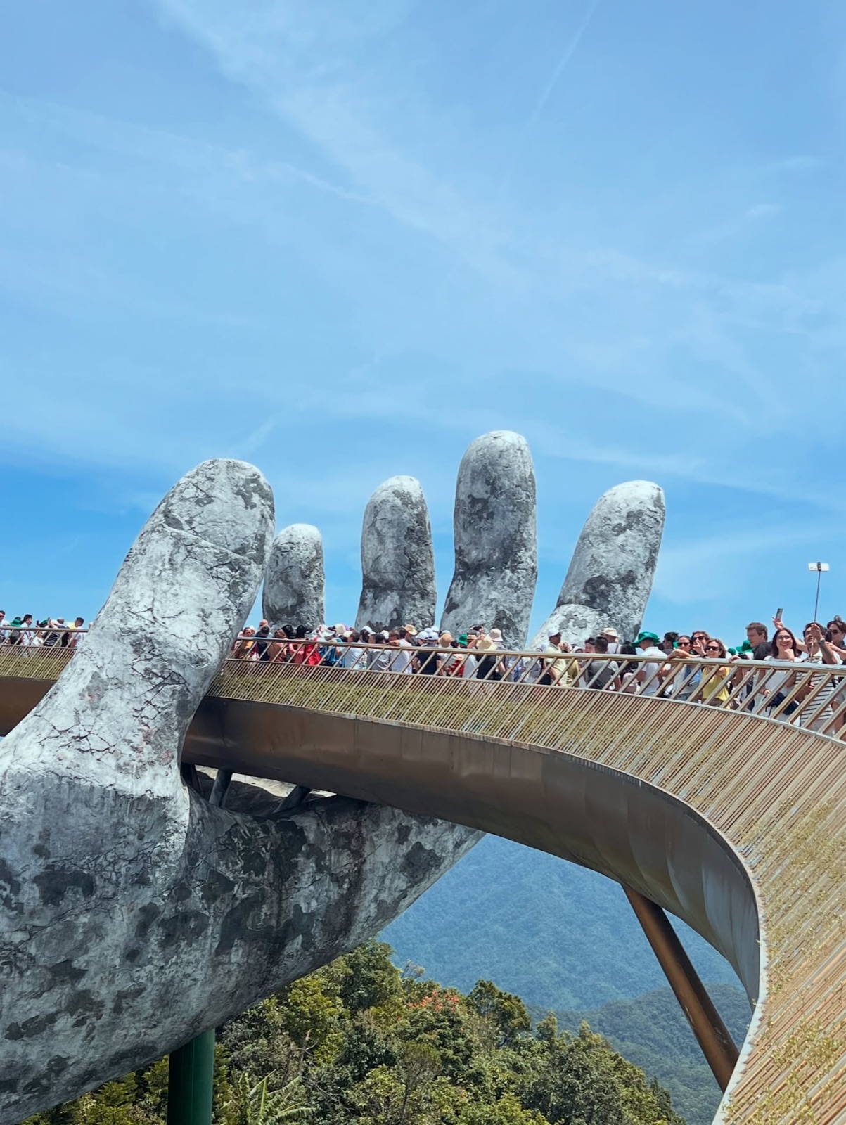 The Golden Bridge held by two giant stone hands above the Bà Nà hills